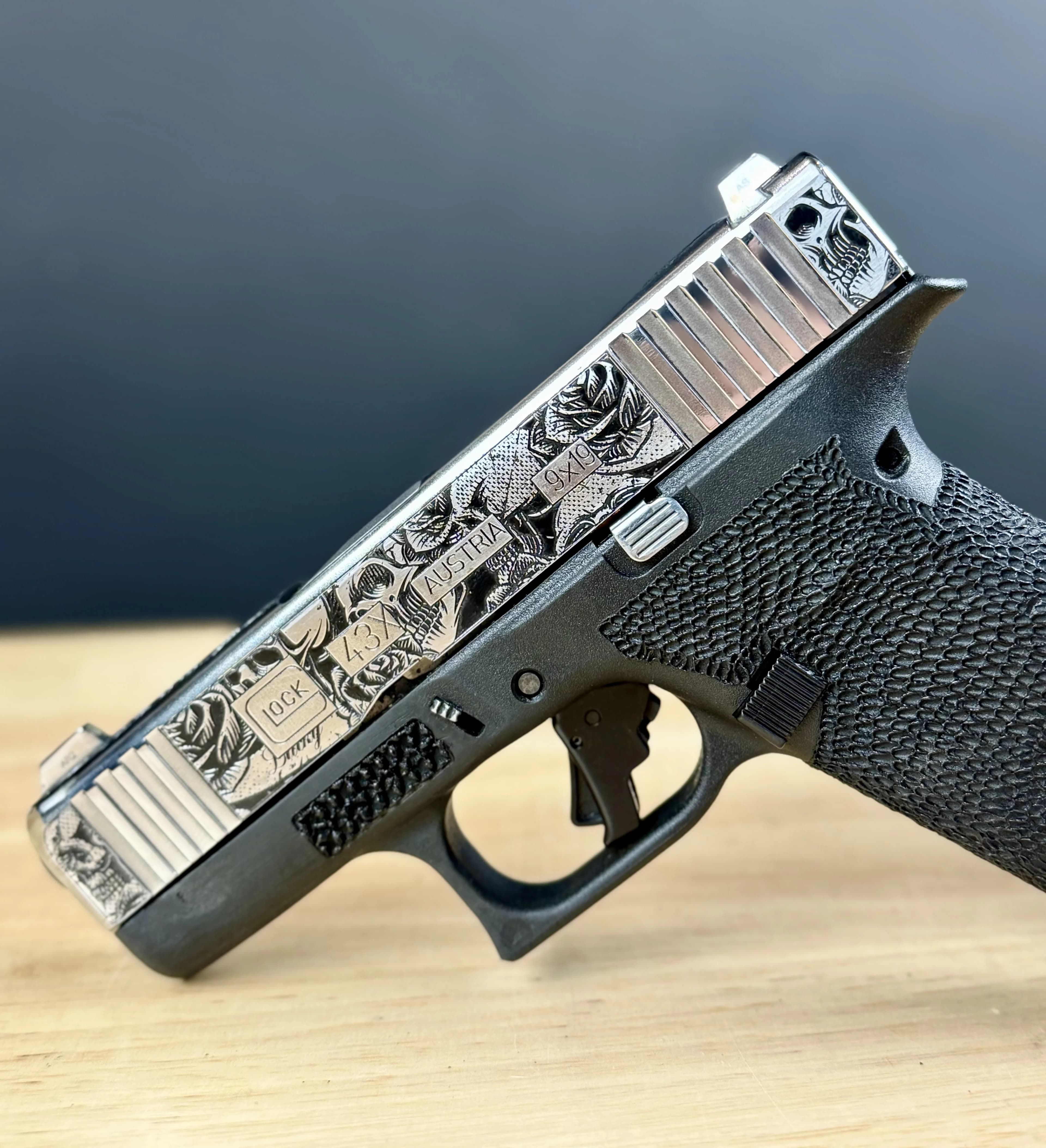 Custom Glock slide featuring topography map line engraving pattern