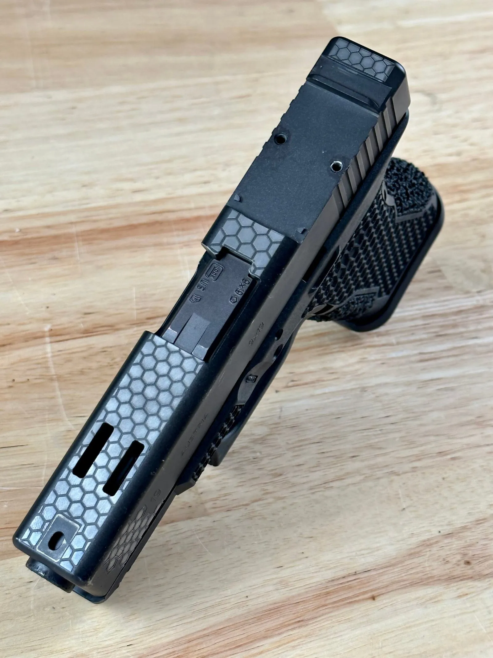 Custom ported pistol slide showing precision port cuts - 365 Weapons