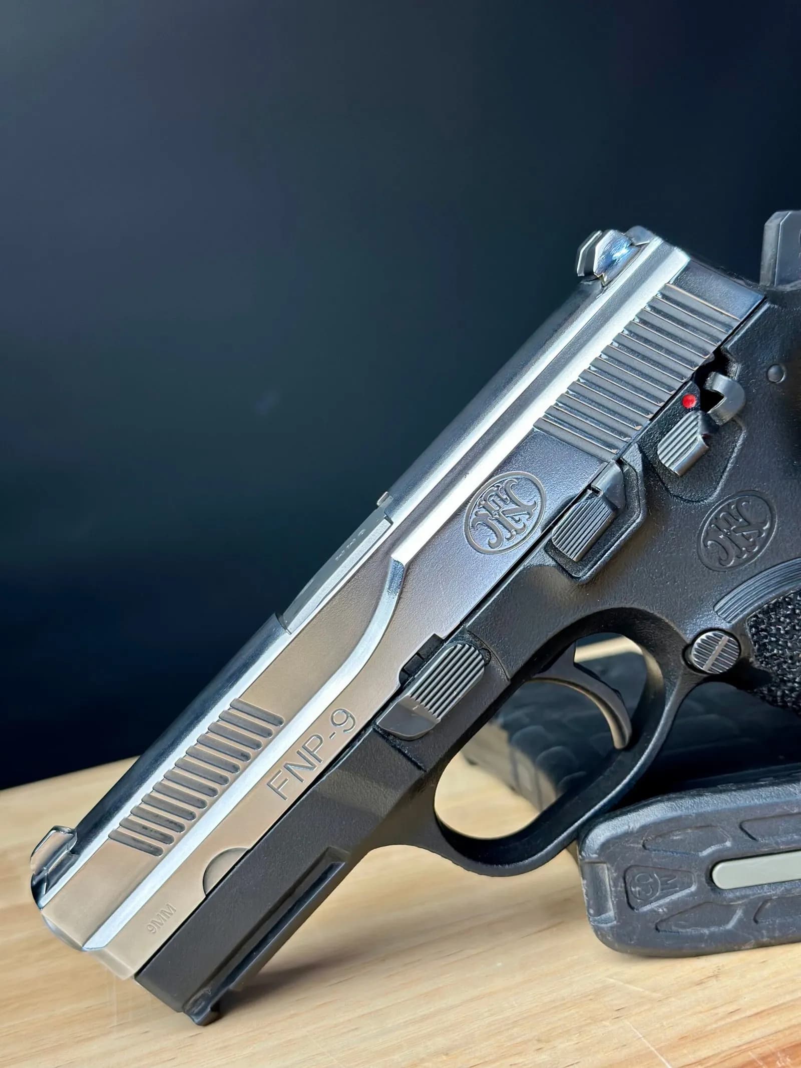 High-polished handgun slide with stunning reflective finish - custom gun polishing